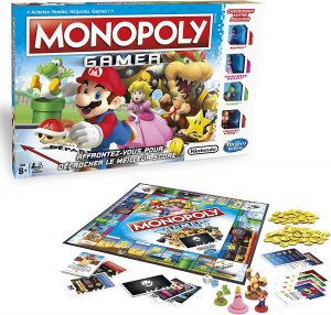 Le jeu de société Monopoly Gamer est déballé devant sa boîte.
